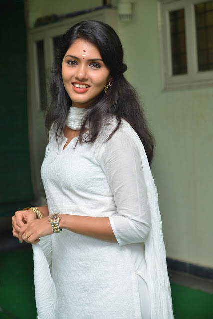 Gayathri Suresh shines in white, exuding charm and grace in her latest cute stills.