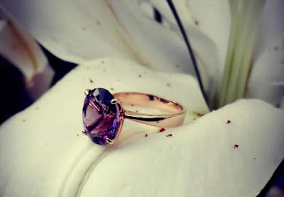 Amethyst set in a solitaire engagement ring