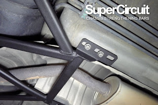 The SUPERCIRCUIT REAR LOWER BRACE installed to the chassis of the Nissan Tiida/ Nissan Latio.