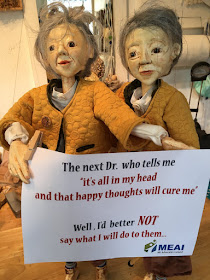 Reflection Puppets getting ready for ME Protest in Dublin. Photo reproduced in Evening Echo article by Corina Duyn