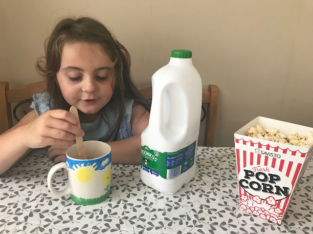 Arla Goodness milk, popcorn, hot chocolate , family night in