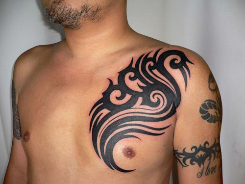 Tribal Chest Tattoos for Men. A tribal tattoo design here draws attention to