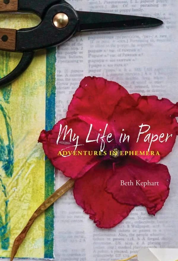 book cover features black-handled shears and watercolor flower