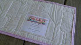 row by row experience quilt label