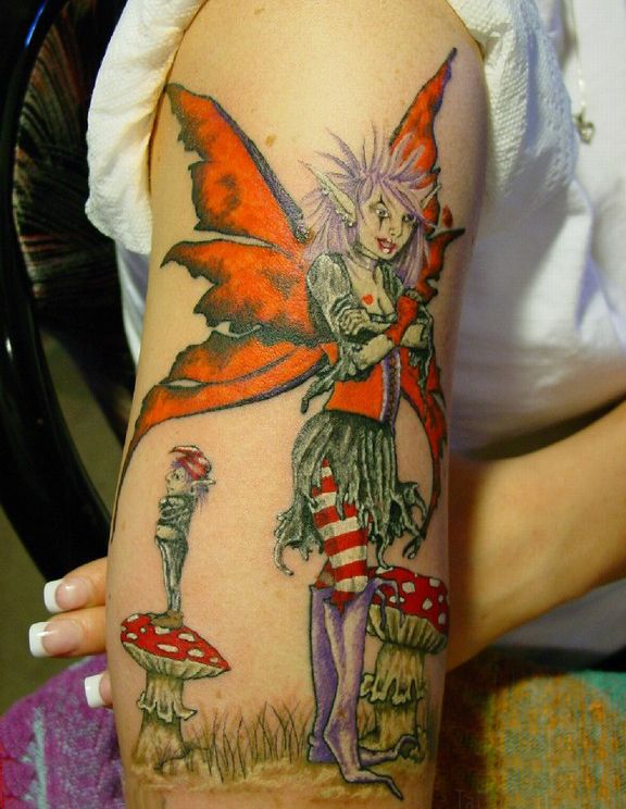 Female Tattoo Gallery With Fairy Tattoo Design On The Upper Arm