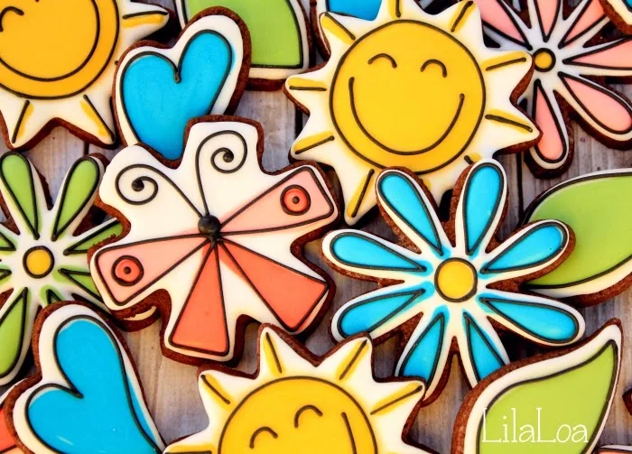 Decorated spring sugar cookies - happy sun, flowers, and hearts