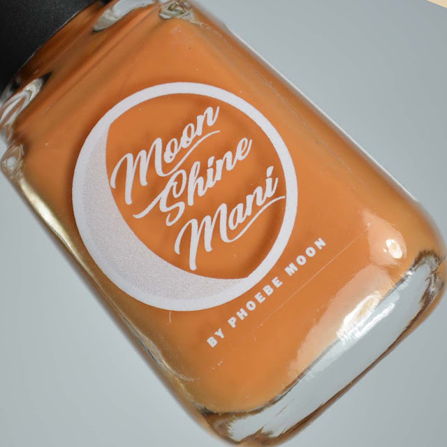 squash colored nail polish in a bottle