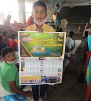 Sabbath School Student receiving AOYM Calendar gift.