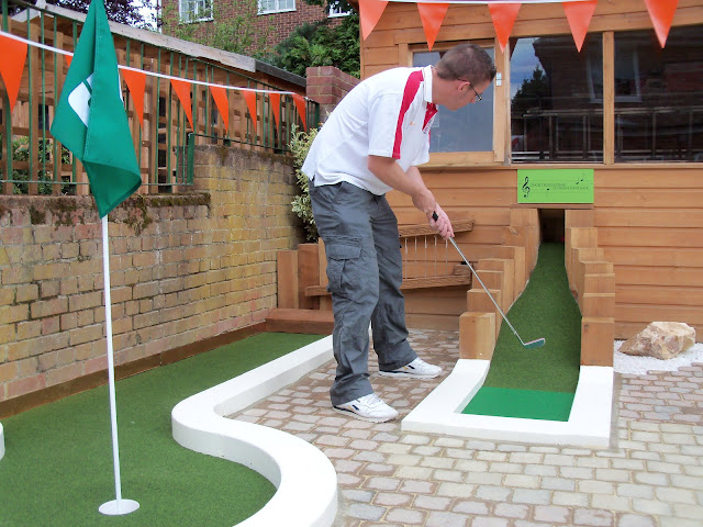 Putting on an UrbanCrazy layout. A Crazy Golf course in a London back garden!