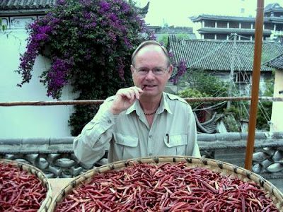 Image of your humble scribe's Dad at the dinner table in Dali, Yunnan Province, China... Sitting in front of a massive tray of dried chilli peppers...