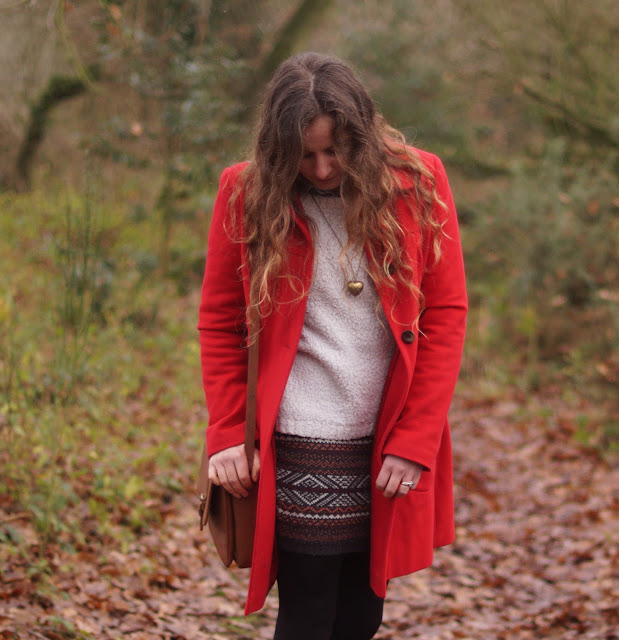 Girl in a red coat in winter