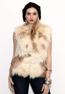 Vintage 1970's vanilla colored marbled Mongolian fur gillet vest with toggle closures.