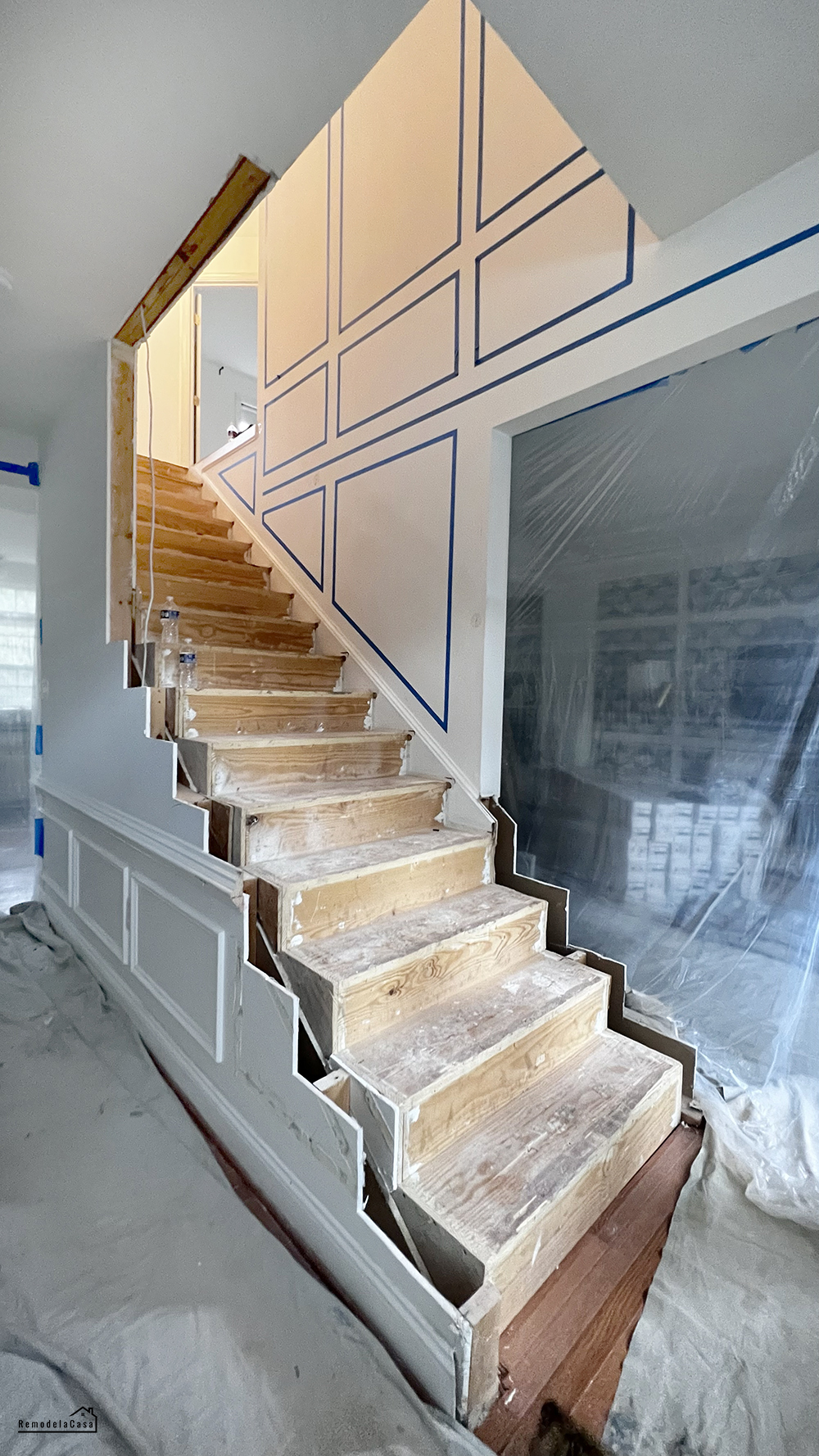 A modern staircase transformation with white oak and square iron balusters