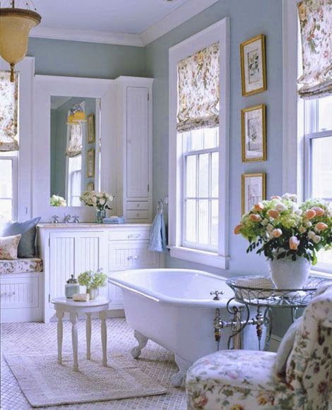 traditional blue and white master bathroom with claw foot tub