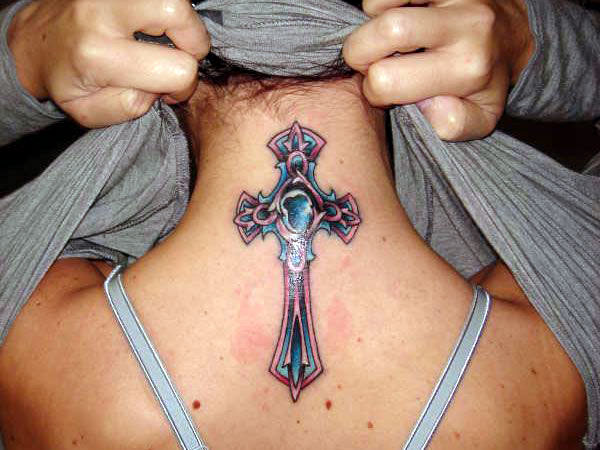 The tattoo design is really a nice celtic cross tattoo with black stone designs
