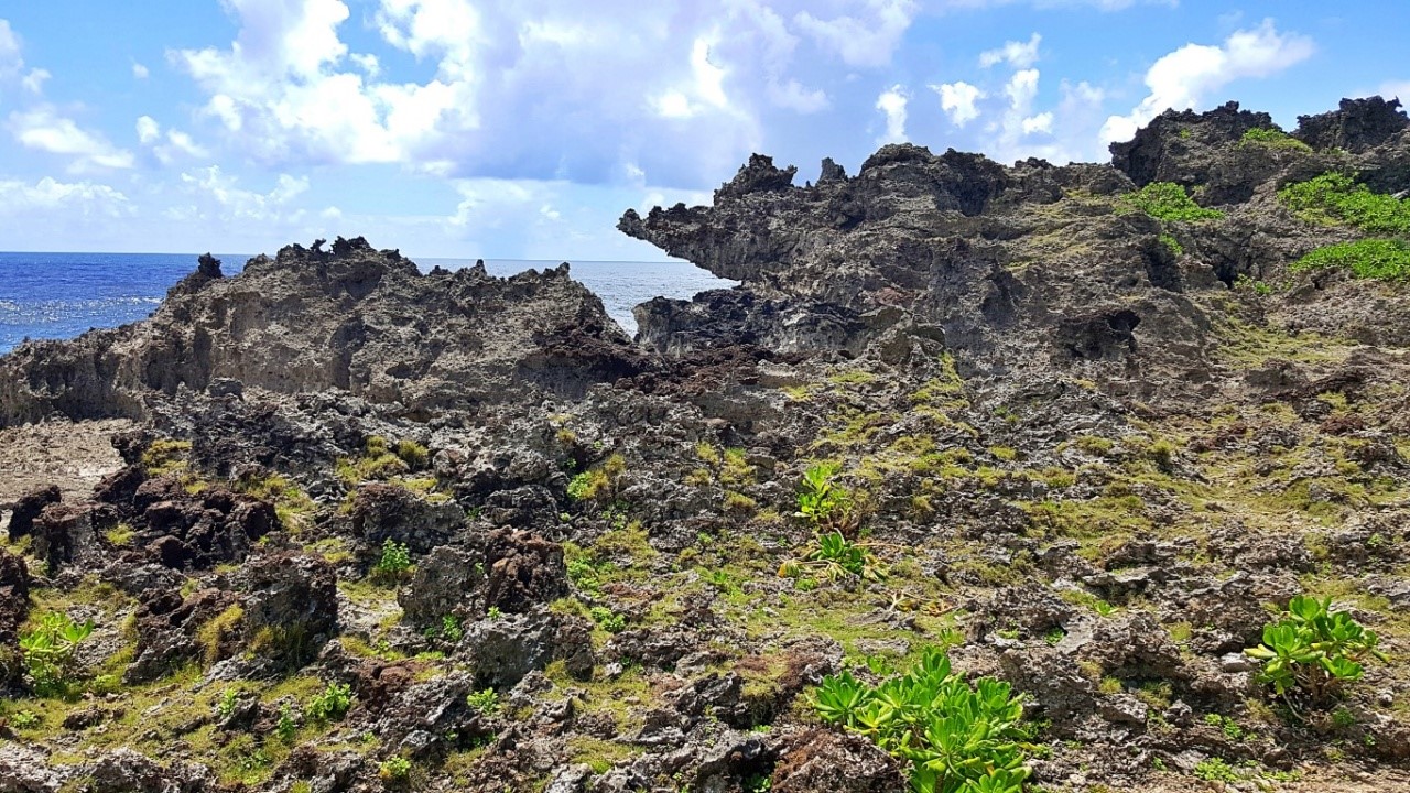 view of the cottages and craggyone of the craggy cliffs at Canhugas Nature Park in Hernani Eastern Samar