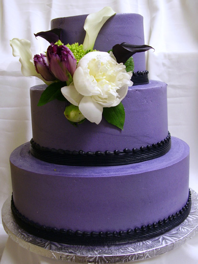 Amazing dark purple with black icing three tier round wedding cake created