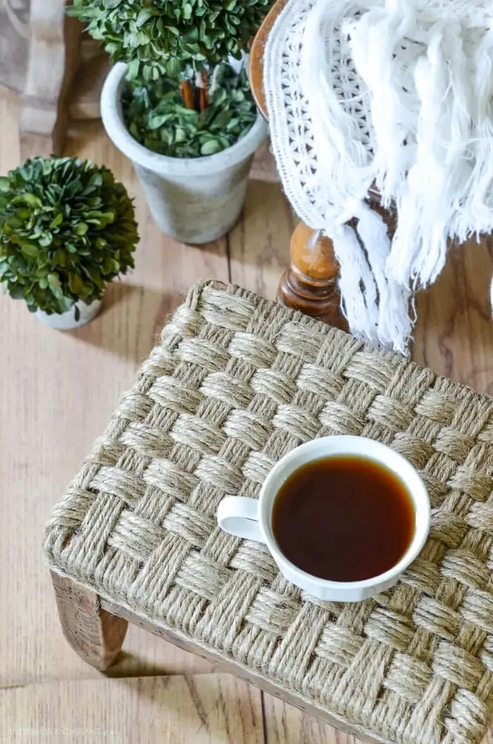 Top of woven footstool with coffee