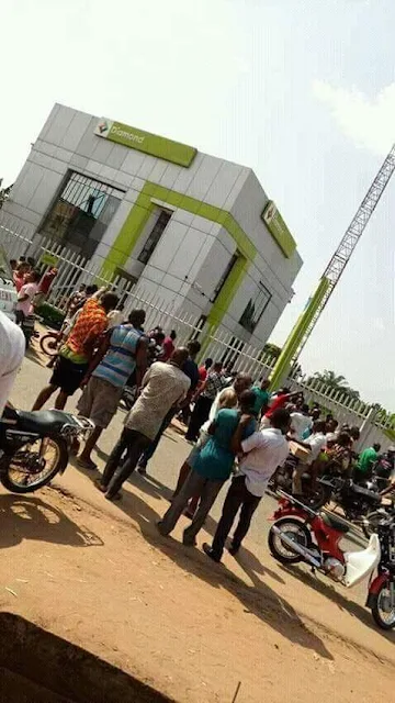 Graphic Photos: Armed robbers storm Diamond Bank in Okija, Anambra, kill school bus driver