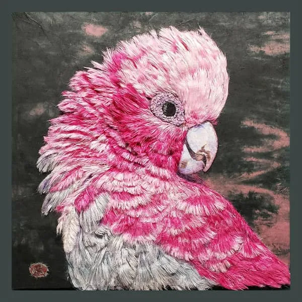 portrait of pink and white parrot made of hanji fibers