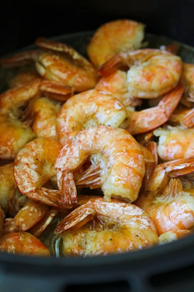 Air Fryer Peel and Eat Shrimp in an air fryer basket.