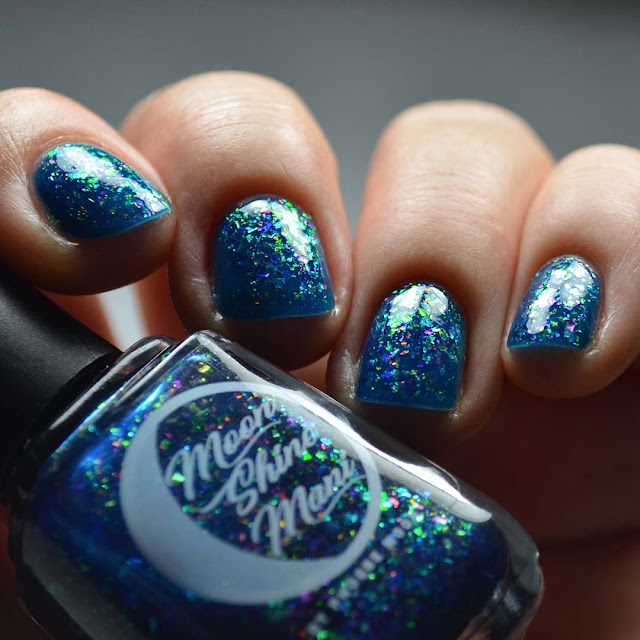 blue jelly nail polish with color shifting flakies swatch