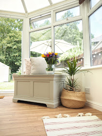 Turn an old unused conservatory into a stylish sunroom with dining table and chairs and blanket box seating area from The Cotswold Company