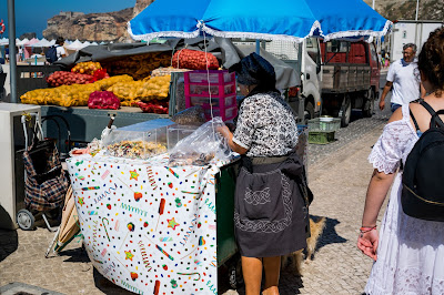 Old woman selling sweets