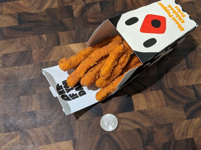An opened box of  Burger King Ghost Pepper Chicken Fries.