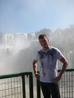 Chad getting soaked under the Iguassu Falls.