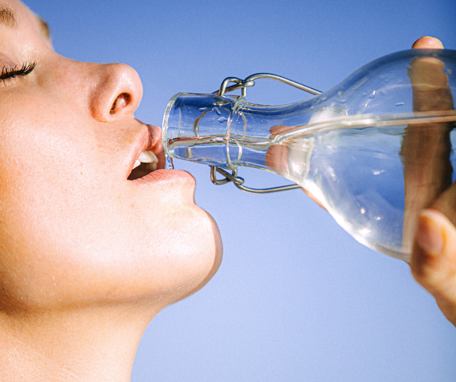 Women Drinking water in sunlight