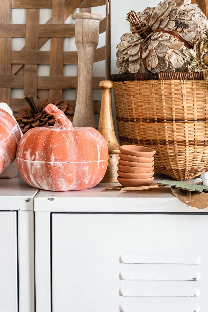 terracotta foam pumpkins with clay stems, tobacco basket, stack of mini terracotta seedling dishes, lockers