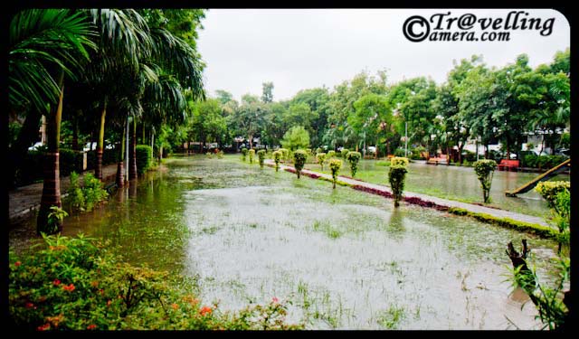 Noida parks flooded with water after rains 2010 - Sector-26 : Monsoon Effect in Noida : Posted by VJ SHARMA at www.travellingcamera.com : This weekend I had to go for a Photo-Walk at Old Fort in Delhi but due to heavy rains I canceled that program and woke up at 11:30 am on Sunday... After that I came out and noticed that many areas in my sector were flooded with water and the park near my house was completely filled with rain water in it.. Here are few photographs of the Sector-26 park after rains on Sunday...Here was the first few I saw in the morning... and then want back to my room to have Camera for capturing these moments :-)One part of Sector-26 park in Noida... where everything is flooded in water and one can walk on the concrete pathways on all four sides...I have seen worst condition of Noida after rains this year... I have been staying here for last 5 years and never seen this kind of after-effects of rains... Noida which is short for the New Okhla Industrial Development Authority, is an area under the management of the New Okhla  Industrial Development Authority... Noida has first-class amenities and is considered to be one of the more modern cities of Uttar Pradesh State of India. It is also home to the Noida Film City...Arre bhai kahan jaoon.. har jagah Paani hi Paani...Fresh green leaves after rains...When it rains, look up rather than down. Without the rain, there would be no rainbow...Noida is a major hub for multinational firms outsourcing IT services... Many large Software and Business Process Outsourcing (BPO) companies have their offices in the city...Generally noida is green and well planned as compared to other cities in UP.... although many of outsiders don't find it a good city to live...Here is the bench where we used to spend lot of time after dinner... Many times plan for morning walks but finally stick to this bench....Rains, Rains go away... please...some reflections inside the water... Hope it gets dry in short time...Reflection of colorful benches in Sector-26 Park in Noida...Water, Water... Everywhere water... no place to sit and no place to play around...Can we store this water somewhere? Many times I see folks in Sector-26 who waste lot of water for washing their multiple cars in summers when some of the areas in Noida doesn't get enough water for their routine activities... but now rains have already washed their cars :-)Its sad that children were not able to enjoy/play outside due to these heavy rains... Check out more about Noida @ http://en.wikipedia.org/wiki/Noida