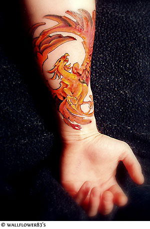 Arm Phoenix tattoo are symbols of rebirth and resurrection.