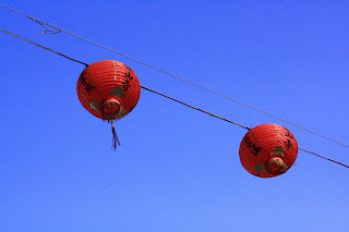 Photo of Chinese lanterns against blue sky