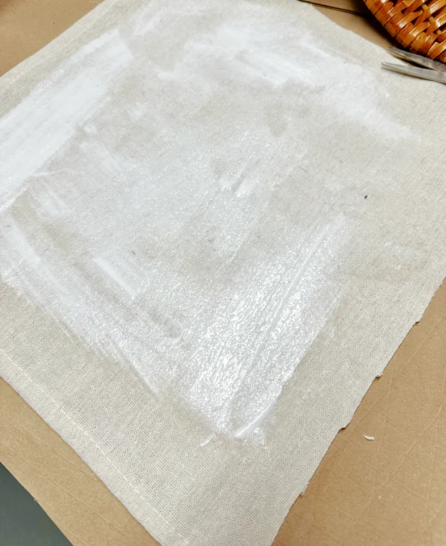 thick coat of mod podge on drop cloth fabric