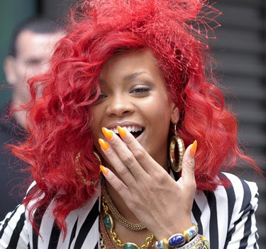 rihanna red hair long. Rihanna Red Hair 2011