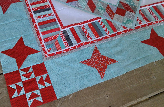 red and aqua string star round robin quilt