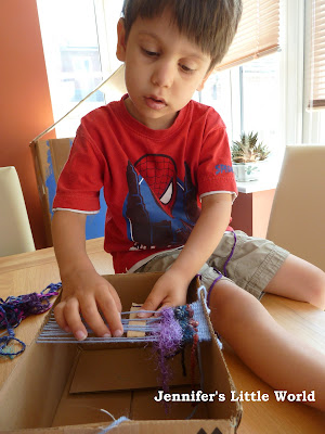 Weaving with children on a cardboard box loom