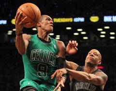 December 25, 2012; Brooklyn, NY, USA; Boston Celtics guard Rajon Rondo (9) drives the lane with defense from Brooklyn Nets forward Keith Bogans (10) during the second quarter of an NBA game at Barclays Center. Mandatory Credit: Brad Penner-USA TODAY Sports