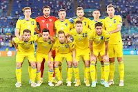 SELECCIÓN DE UCRANIA. Temporada 2020-21. Illia Zabarnyi, Georgiy Bushchan, Serhiy Kryvtsov, Andriy Yarmolenko, Vitaliy Mykolenko, Serhiy Sydorchuk. Oleksandr Karavaev, Mykola Shaparenko, Oleksandr Zinchenko, Mykola Matviyenko, Roman Yaremchuk. SELECCIÓN DE INGLATERRA 4 SELECCIÓN DE UCRANIA 0. 03/07/2021. Eurocopa 2020, 16ª edición, cuartos de final. Roma, Italia, estadio Olímpico. GOLES: 1-0: 4’, Harry Kane. 2-0: 46’, Maguire. 3-0: 47’, Harry Kane. 4-0: 63’, Henderson.