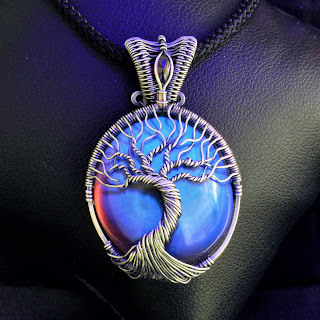 Amber & Sterling Silver Tree of Life Necklace wire wrapped by Tim Whetsel - Black background & black light bulb