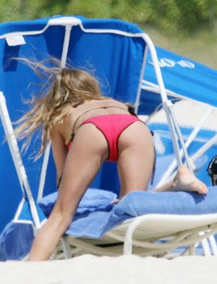 Fergie in her red bikinis while playing in the heat of the sun