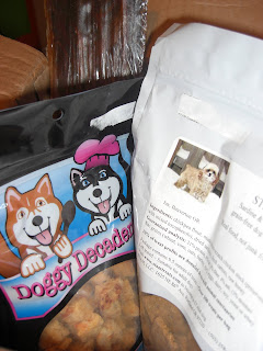 Picture of the treats Toby received, 2 treat bags & a beef jerky stick!