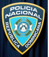 CANCELAN POLICÍA DOMINICANO POR MATAR ENAJENADO MENTAL EN PARQUE INFANTIL DE BAYAGUANA