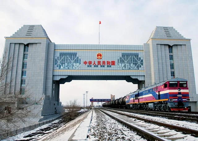 Image Attribute: Chinese Freight Train crossing an International Border / Creative Commons