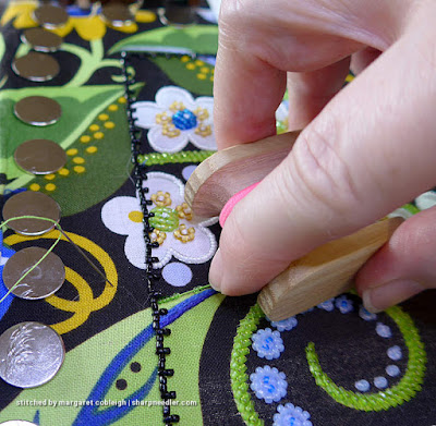 Showing how to hold the koma and feed beads while beading. (Wild Child Japanese Bead Embroidery by Mary Alice Sinton)