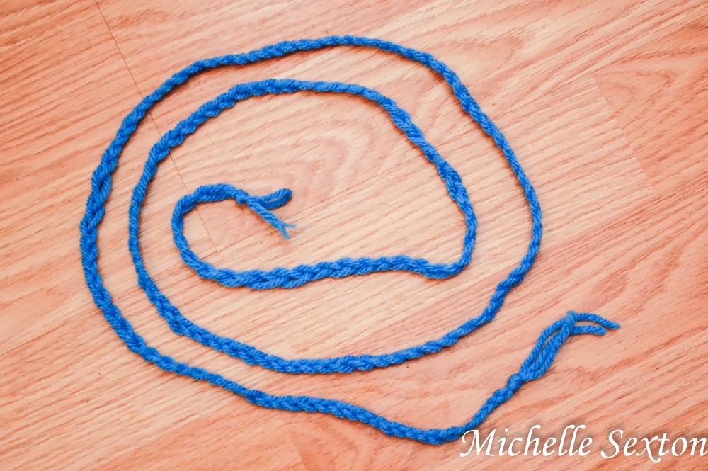 braid 3 strands of yarn together