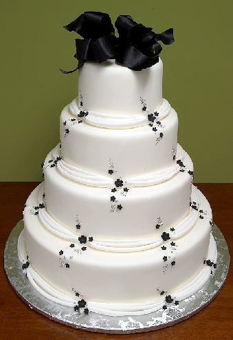 wedding cake with chocolate black at the top