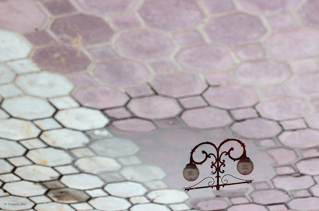  A Minimalist Photograph of the reflection of Garden Lamps at the Akshardham Temple, Jaipur